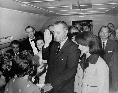 1024px-Lyndon_B._Johnson_taking_the_oath_of_office,_November_1963