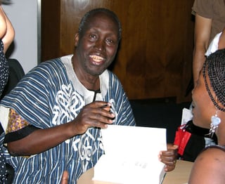 Ngũgĩ_wa_Thiong'o_(signing_autographs_in_London)_PD.jpg